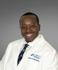 medical provider, male, white coat, glasses, white shirt tie