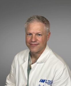 medical provider, white jacket, blonde hair