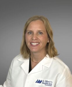 female medical provider, blonde hair, white jacket