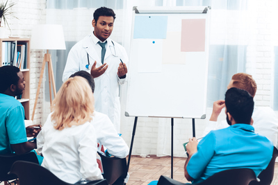 Indian Doctor teaching a class for nurses